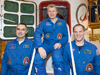 In the Integration Facility at the Baikonur Cosmodrome in Kazakhstan, the Expedition 33 prime crew poses for pictures at the hatchway of their Soyuz TMA-06M spacecraft at the completion of their final prelaunch 